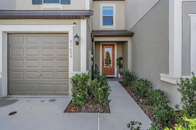 doorway to property featuring a garage