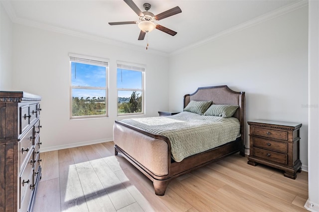 bedroom featuring ceiling fan, crown molding, and light wood-type flooring