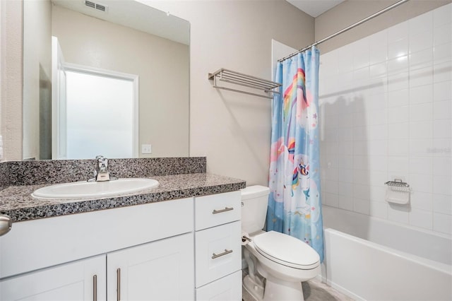 full bathroom featuring vanity, shower / tub combo, and toilet