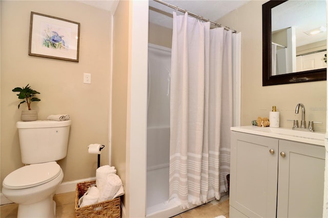 bathroom featuring tile patterned floors, vanity, a shower with shower curtain, and toilet