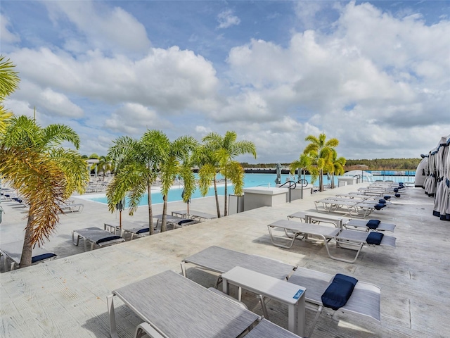 view of patio with a water view