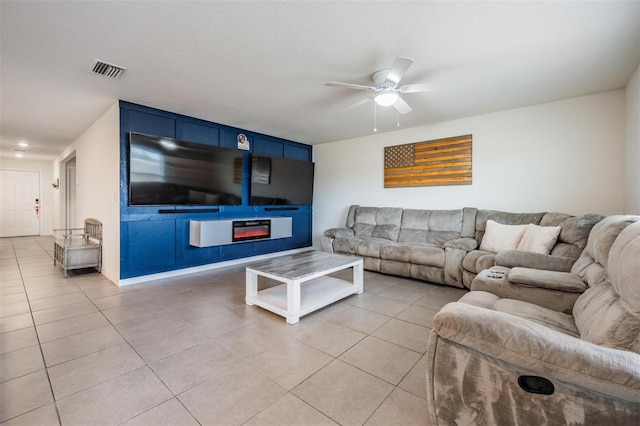 tiled living room featuring ceiling fan