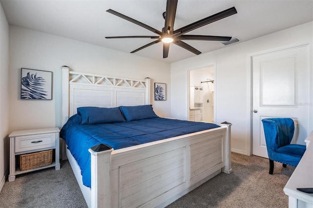 carpeted bedroom with connected bathroom and ceiling fan