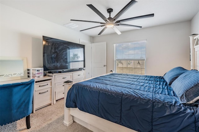 bedroom featuring ceiling fan and light carpet