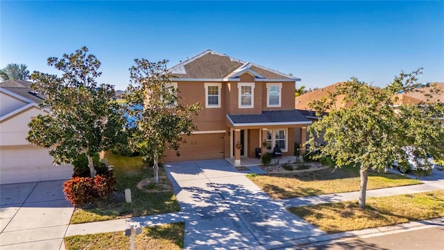 view of front of house with covered porch and a garage