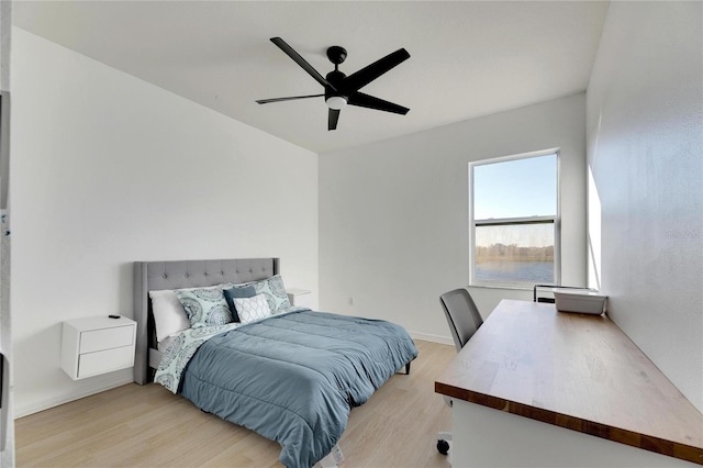 bedroom with light hardwood / wood-style floors and ceiling fan