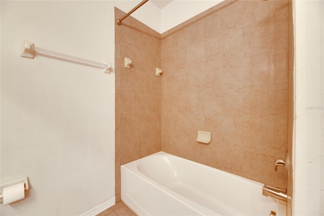 bathroom featuring tile patterned flooring and tiled shower / bath combo