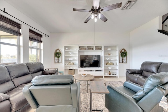 living room featuring ceiling fan and light wood-type flooring