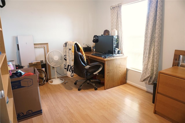 office with light wood-type flooring