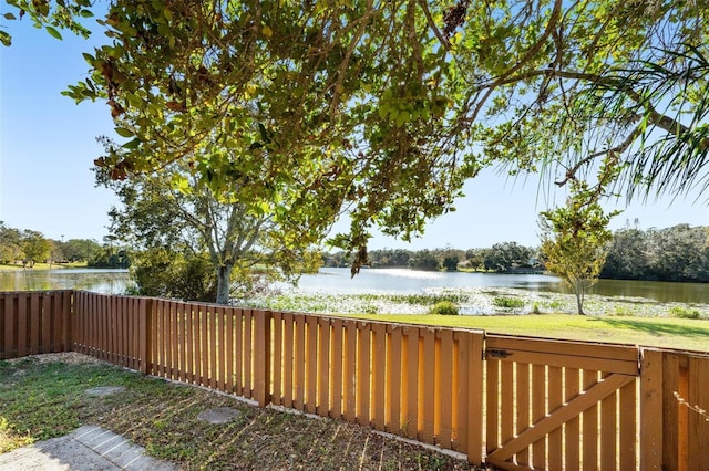 wooden deck featuring a water view