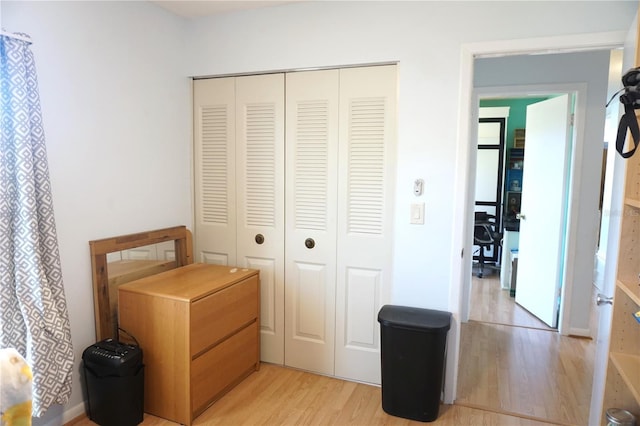 interior space with a closet and light hardwood / wood-style flooring