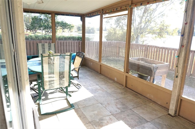 unfurnished sunroom with plenty of natural light