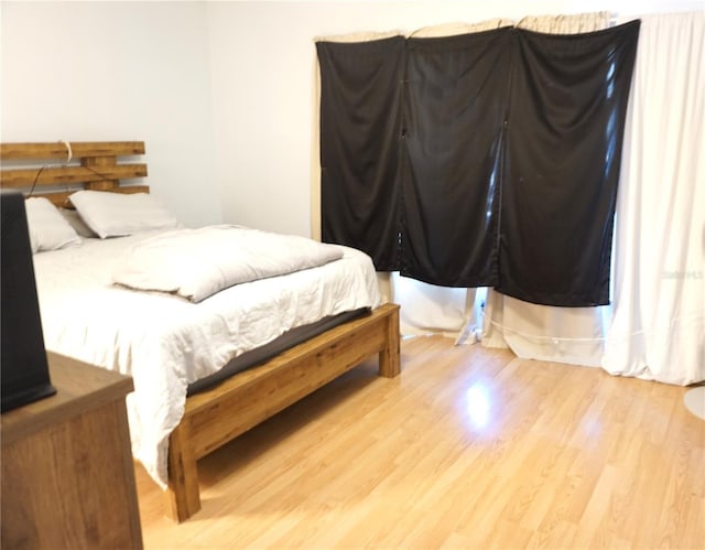 bedroom featuring light hardwood / wood-style floors