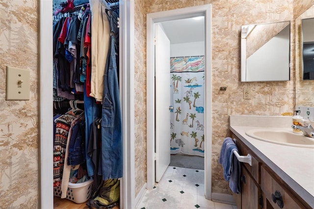 bathroom featuring tile patterned flooring and vanity