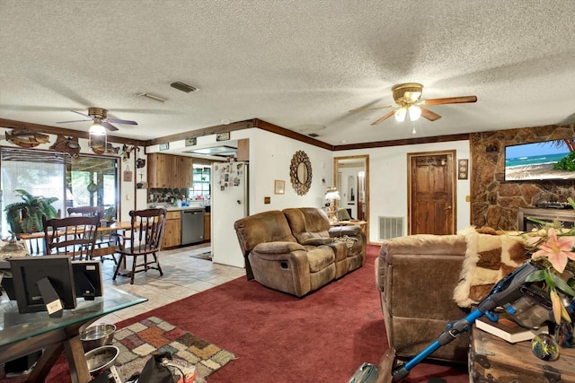 tiled living room featuring ceiling fan, crown molding, and a textured ceiling