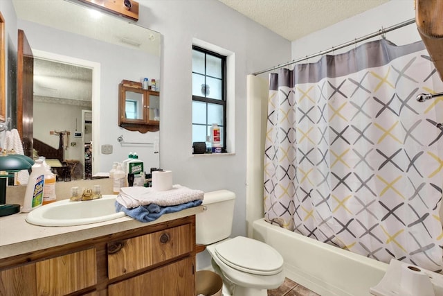 full bathroom with vanity, tile patterned flooring, toilet, shower / bathtub combination with curtain, and a textured ceiling