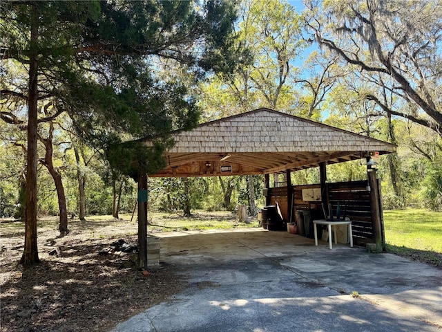 view of community featuring concrete driveway