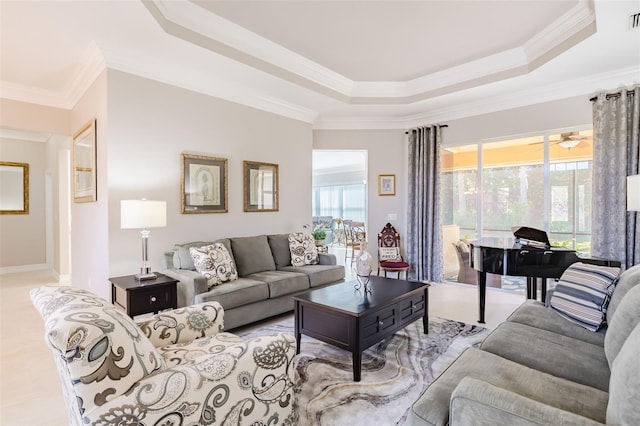 living room featuring ceiling fan, crown molding, and a raised ceiling