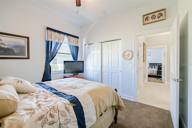 carpeted bedroom with ceiling fan and a closet