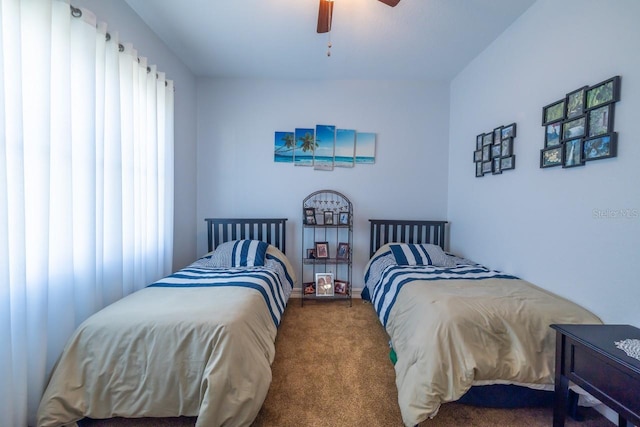 bedroom featuring ceiling fan and carpet floors