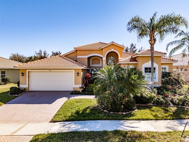 mediterranean / spanish-style home featuring a garage