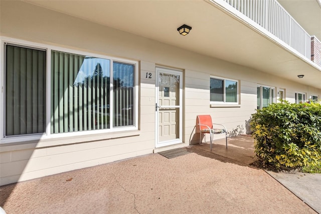 property entrance featuring a patio area