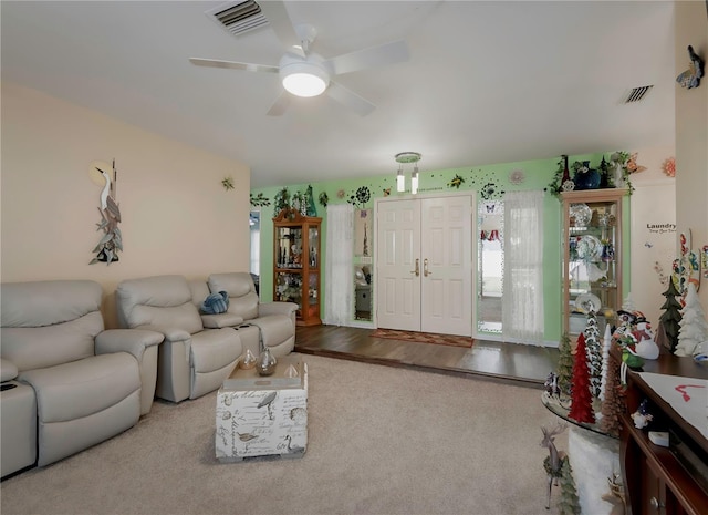 living room with ceiling fan and light wood-type flooring