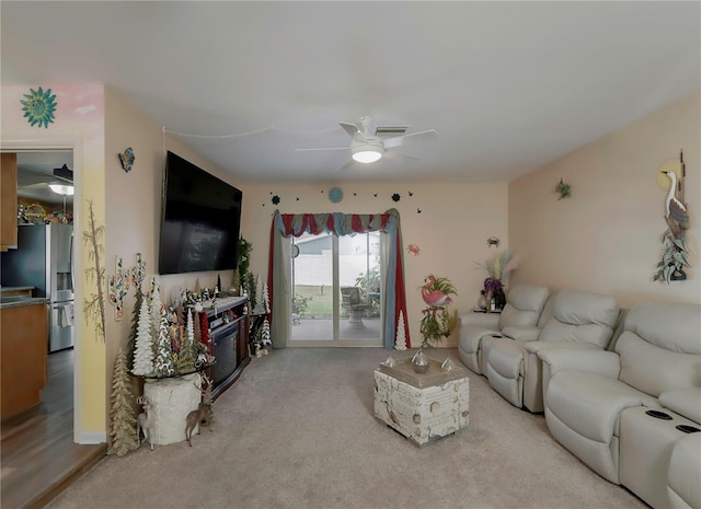 living room with ceiling fan and light carpet