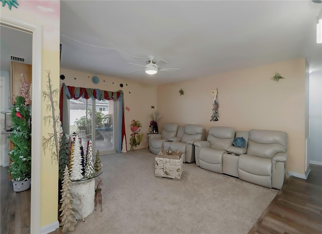 living room with hardwood / wood-style floors and ceiling fan