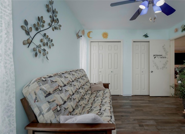 sitting room with ceiling fan and dark hardwood / wood-style flooring