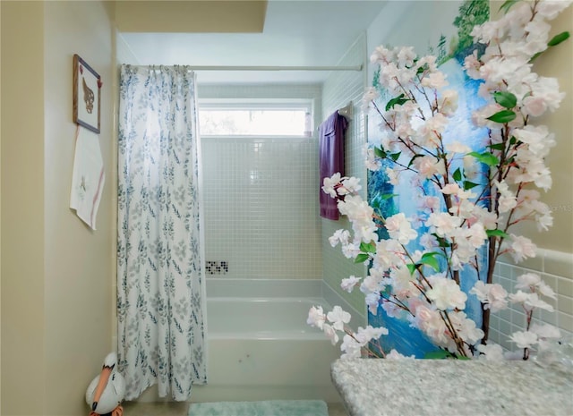 bathroom featuring shower / bathtub combination with curtain