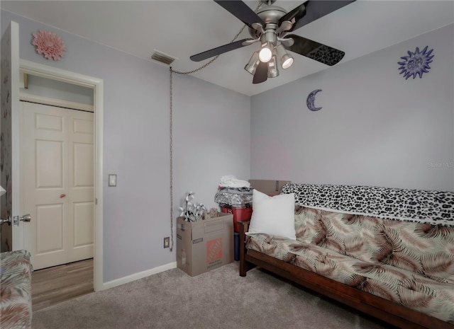 carpeted bedroom with ceiling fan