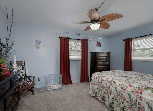 carpeted bedroom with ceiling fan