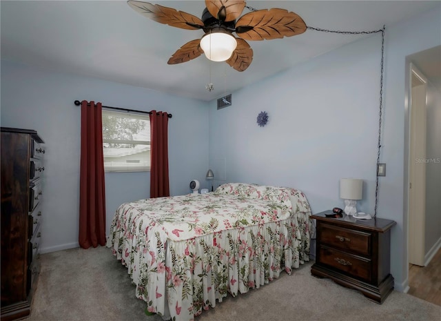 bedroom featuring ceiling fan and light carpet