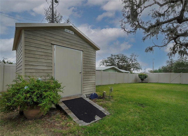 view of outdoor structure featuring a yard