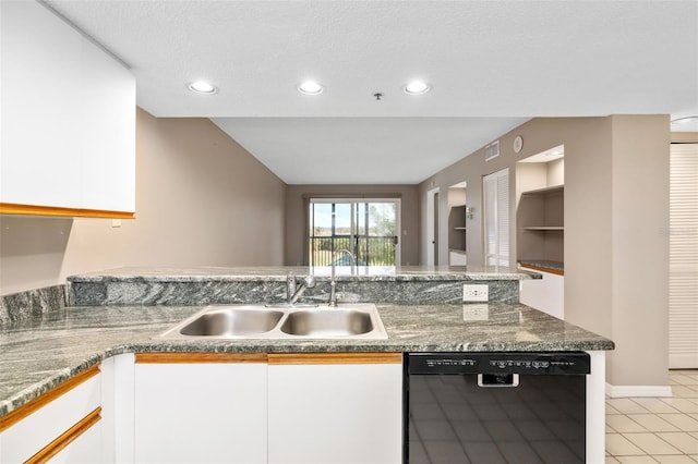 kitchen with a textured ceiling, sink, black dishwasher, white cabinetry, and light tile patterned flooring