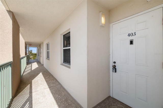 entrance to property featuring covered porch