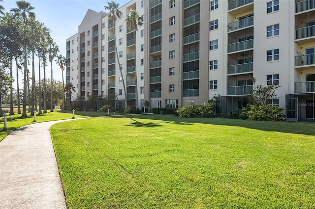 view of property's community with a yard