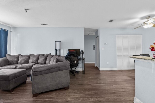 10265 Gandy Blvd N Unit 905, Saint Petersburg, FL 33702 - living area with dark wood-style flooring, ceiling fan, and baseboards