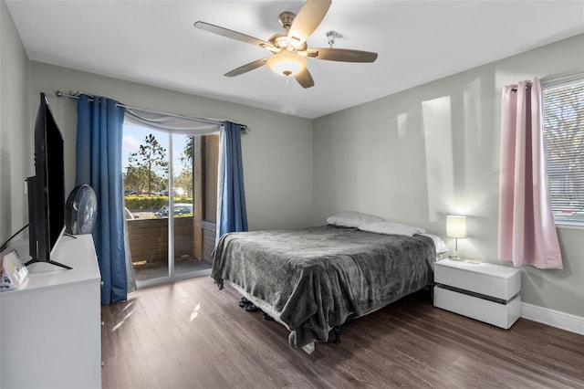 bedroom with dark hardwood / wood-style flooring, access to outside, multiple windows, and ceiling fan