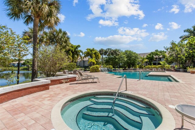 10265 Gandy Blvd N Unit 905, Saint Petersburg, FL 33702 - community pool with a hot tub and a patio