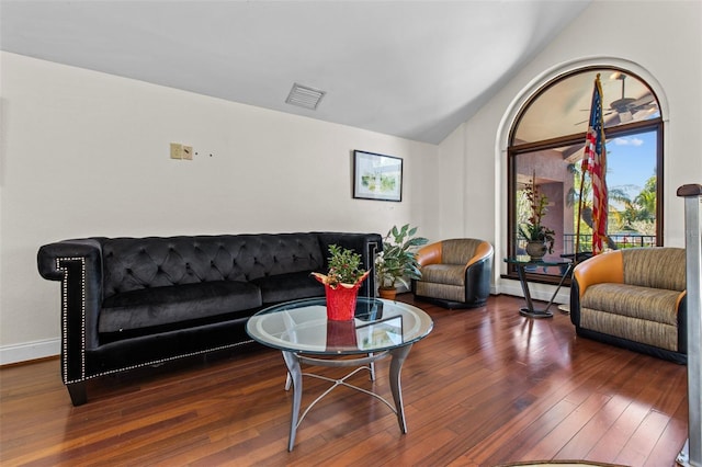 10265 Gandy Blvd N Unit 905, Saint Petersburg, FL 33702 - living room featuring wood-type flooring, lofted ceiling, and baseboards