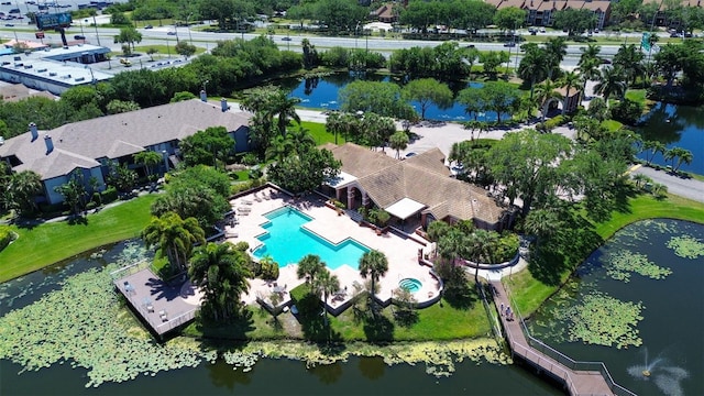 birds eye view of property with a water view