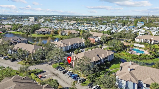 bird's eye view with a residential view and a water view