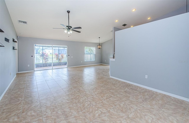 spare room featuring a ceiling fan, visible vents, high vaulted ceiling, and baseboards