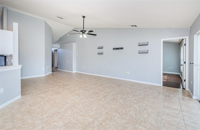 unfurnished room featuring vaulted ceiling, visible vents, ceiling fan, and baseboards