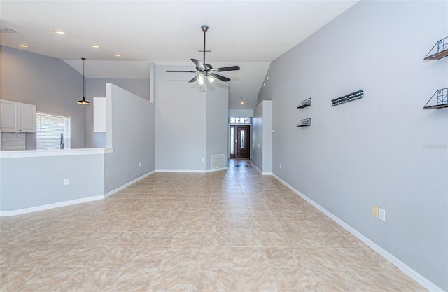 spare room with high vaulted ceiling, recessed lighting, visible vents, a ceiling fan, and baseboards