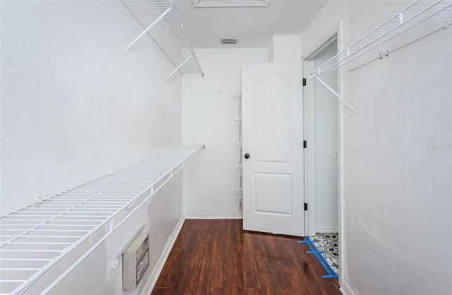 spacious closet with wood finished floors and visible vents