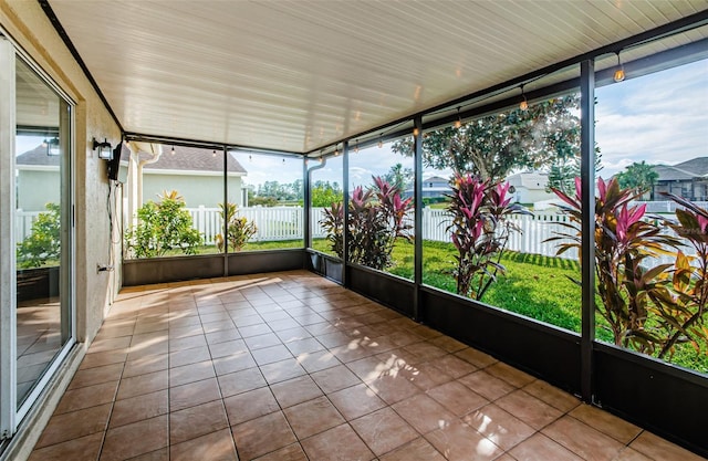 unfurnished sunroom featuring a healthy amount of sunlight