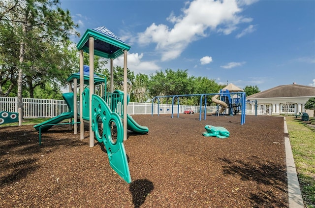 community jungle gym featuring fence